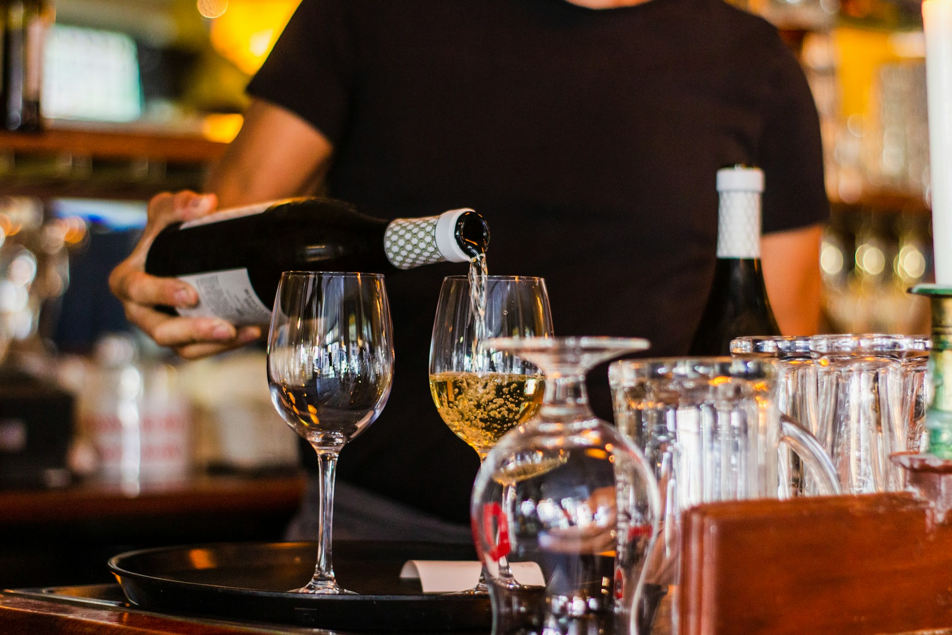 Person pouring wine