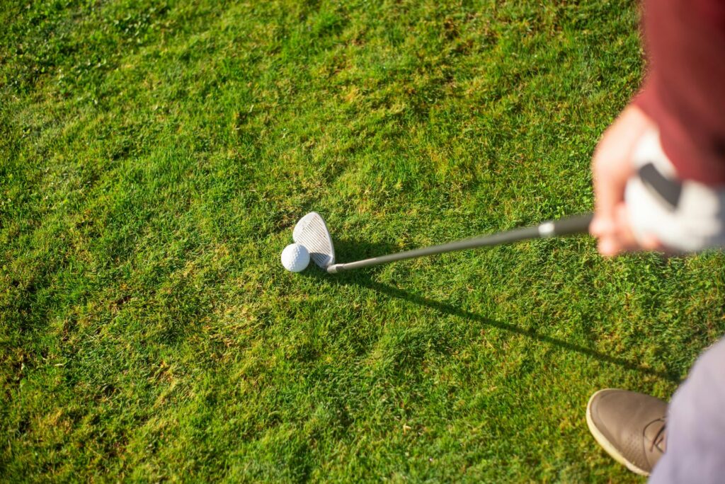 A golf ball and golf club
