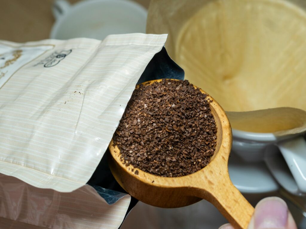 Scooping out ground coffee